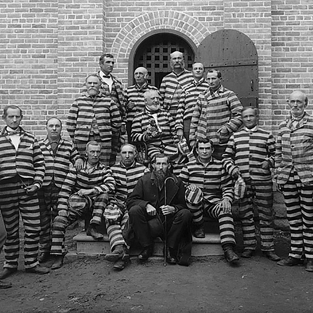 Vintage Prisoners in front of Prison